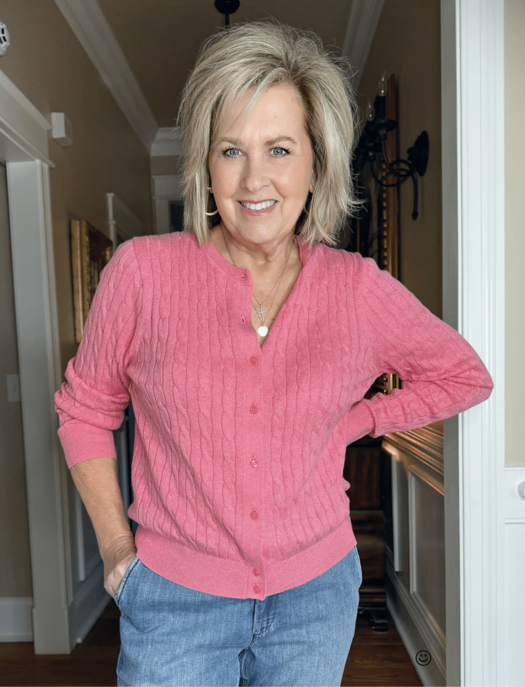 Tania Stephens is wearing a medium pink sweater cardigan from J.Crew Factory